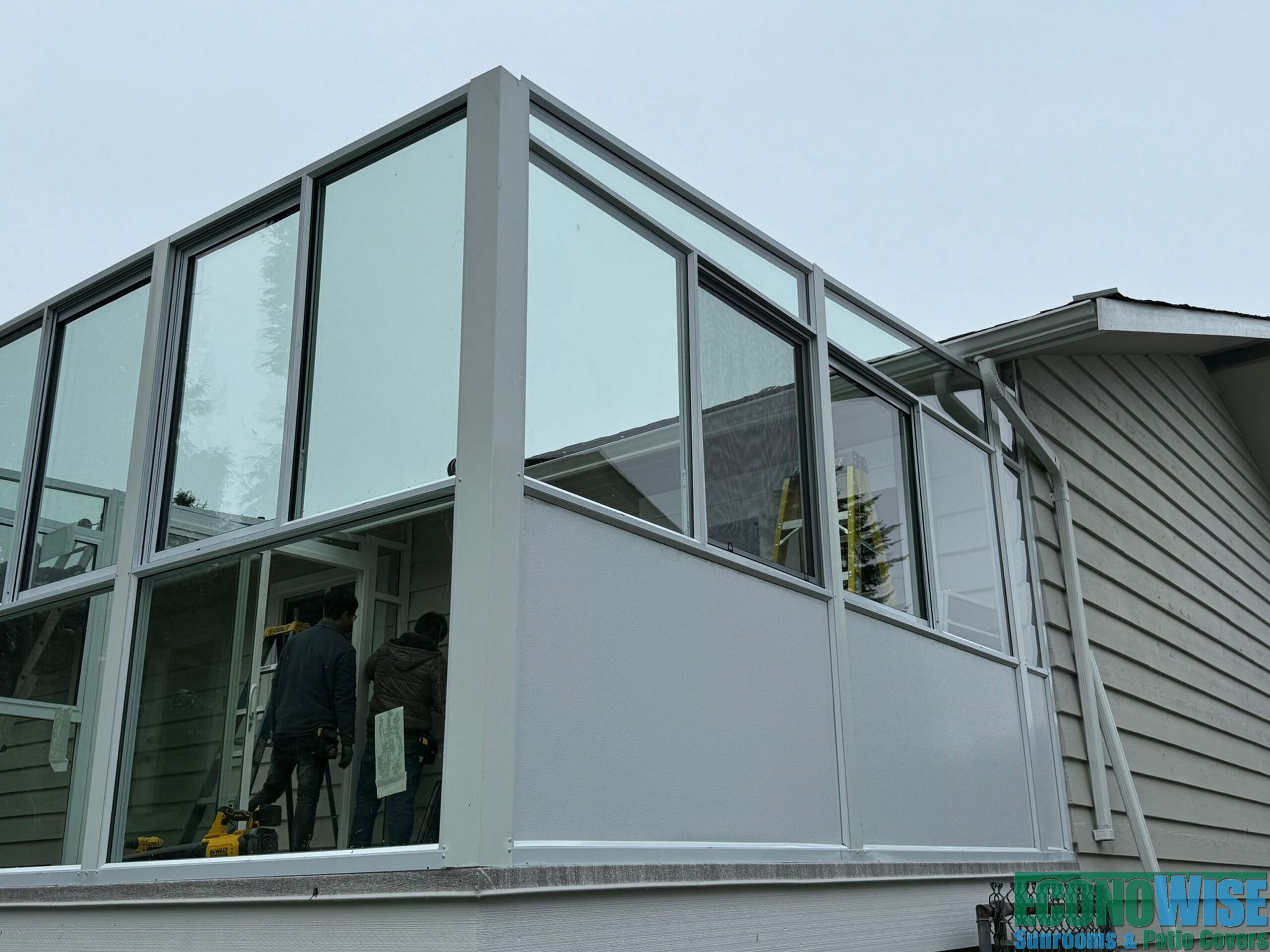 Converting an old deck into a sunroom with a covered BBQ area